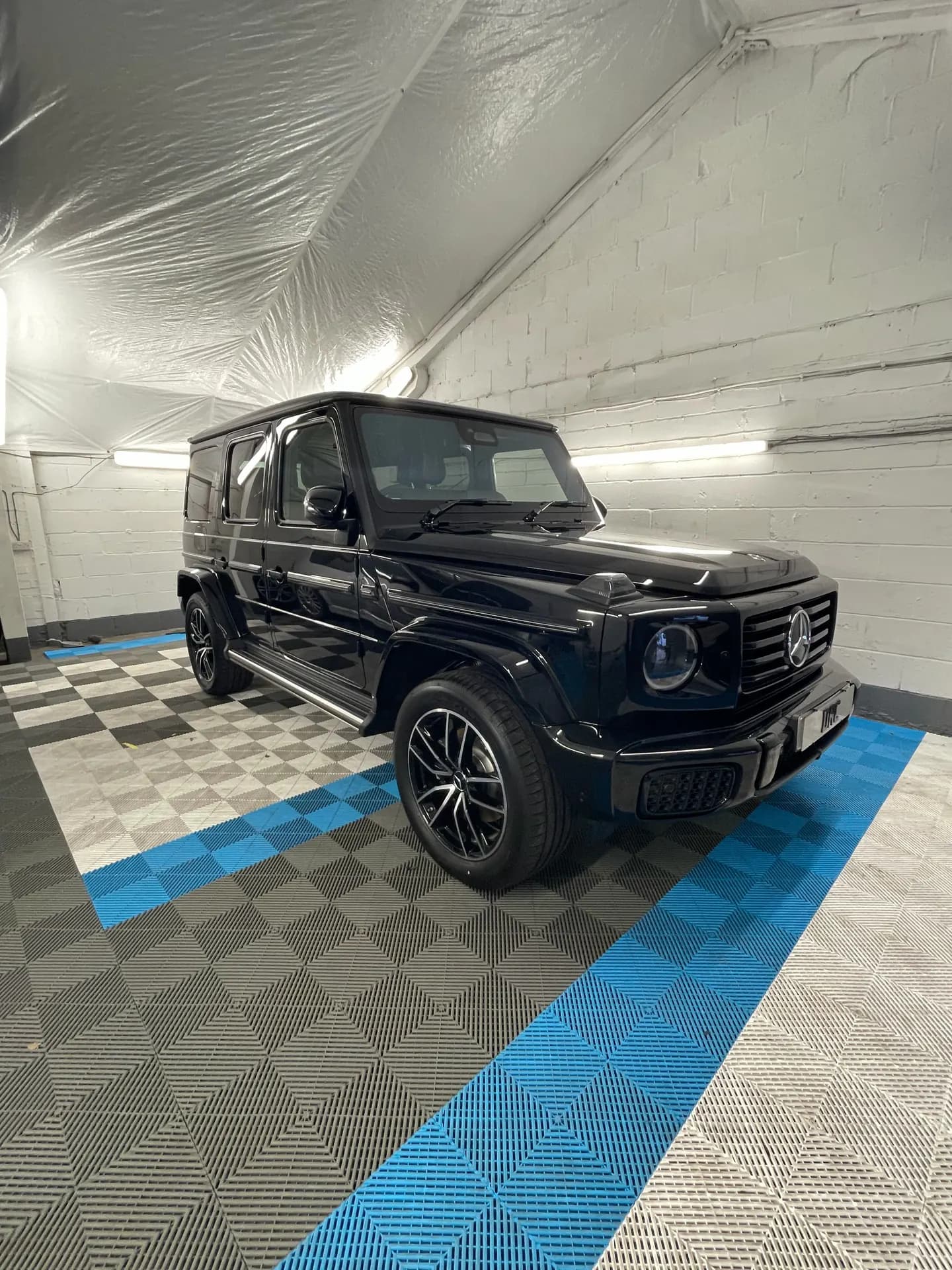 Black Mercedes G-Class after detailing by DRC Car Care, in the DRC Car Care unit