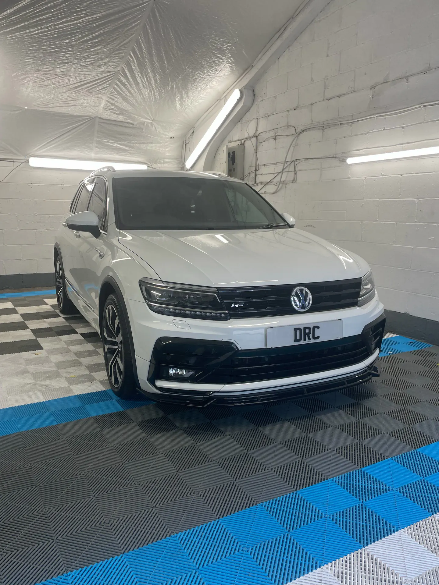 White Volkswagen Tiguan R-Line after detailing by DRC Car Care, in the DRC Car Care unit